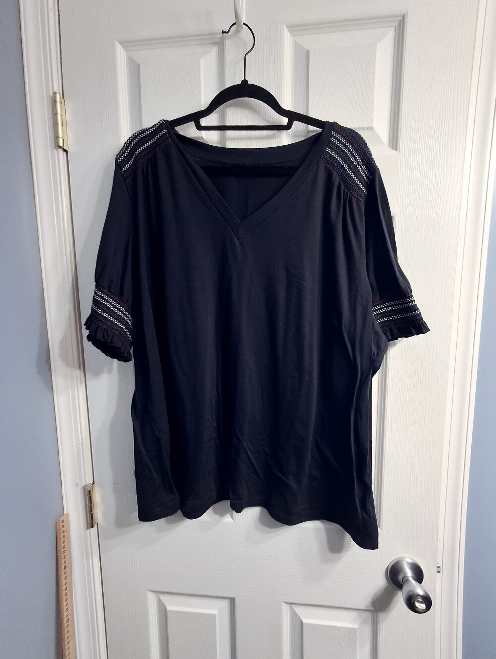 BloomChic Black V-Neck Top with Embroidered Sleeve Accents
